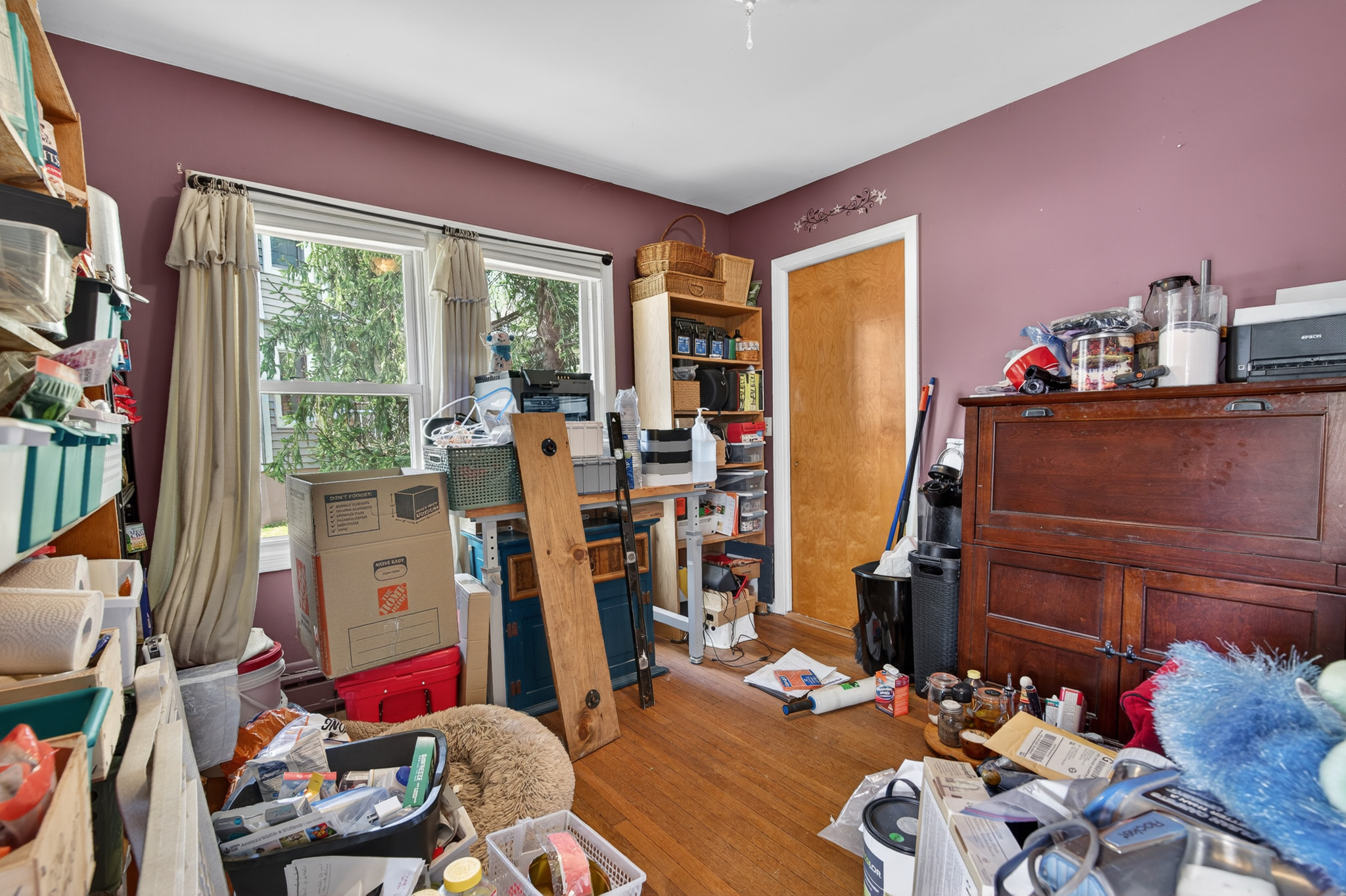 Cluttered bedroom before virtual renovation